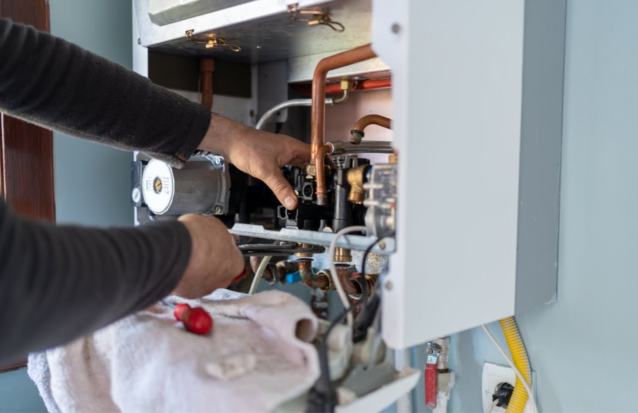 engineer working on heater unit